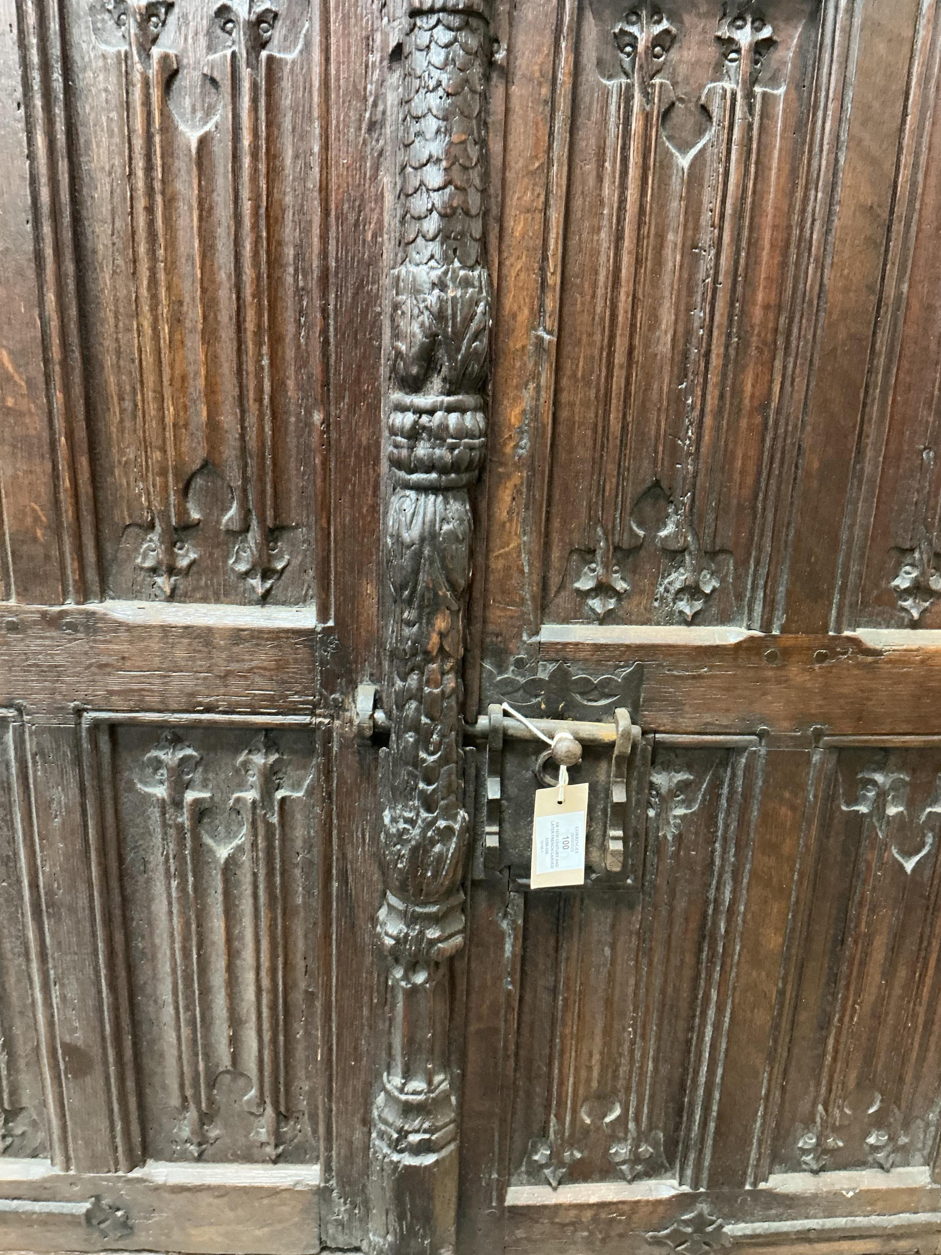 An 18th century and later French carved oak two door cabinet, width 115cm, depth 53cm, height 115cm